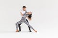 Passionate couple dancing social danse kizomba or bachata or semba or taraxia on white background with copy space Royalty Free Stock Photo