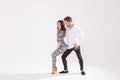 Passionate couple dancing social danse kizomba or bachata or semba or taraxia on white background with copy space Royalty Free Stock Photo