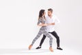 Passionate couple dancing social danse kizomba or bachata or semba or taraxia on white background with copy space Royalty Free Stock Photo