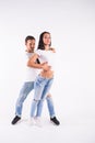 Passionate couple dancing social danse kizomba or bachata or semba or taraxia on white background Royalty Free Stock Photo