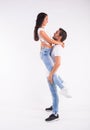 Passionate couple dancing social danse kizomba or bachata or semba or taraxia on white background Royalty Free Stock Photo