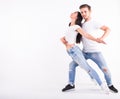 Passionate couple dancing social danse kizomba or bachata or semba or taraxia on white background Royalty Free Stock Photo