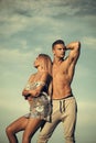Passionate couple kissing, boy and girl. Bodybuilder with muscular torso
