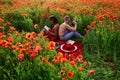 Passionate couple on spring field. Lovers in flowers. Inspiration from nature. Sensual concept. Love story.