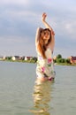 Passionate girl in a nightgown in the lake