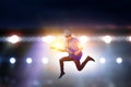 Passionate guitarist with hat jumps Royalty Free Stock Photo