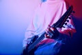 Passionate Guitarist Music Concept Photo. Electric Guitar Playing Closeup Photo. rock music band. Neon light club Royalty Free Stock Photo