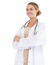 Passionate about her profession. A beautiful female doctor smiling at the camera with her arms folded. Royalty Free Stock Photo