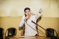 Passionate Man Speaking into Microphone in Meeting Royalty Free Stock Photo