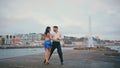 Passionate pair performing latin american dance on embanking. Couple dancing Royalty Free Stock Photo