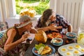 passionate people, a couple, eat healthy and healthy food. A woman holds a glass of lemonade in her hand. Bright Sunny Royalty Free Stock Photo