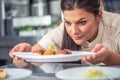 Passionate pro female chef presents her sushi delicacy Royalty Free Stock Photo