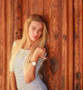 Passionate sensual beautiful girl portrait on background of decorative vintage wooden door