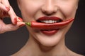 Passionate woman eating hot chili Royalty Free Stock Photo