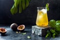 Passionfruit iced green tea or lemonade with lime and mint. Tropical refreshing cold drink