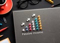 Passive income text with pin garph chart on business table Royalty Free Stock Photo