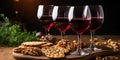 Passover background. Four wine glasses and jewish matzah dark background Royalty Free Stock Photo