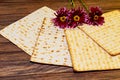 passover background. matzoh jewish holiday bread and flowers on gerbera Royalty Free Stock Photo