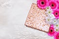 Passover background. matzoh (jewish passover bread) and flowers on white table cloth Royalty Free Stock Photo