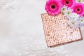Passover background. matzoh (jewish passover bread) and flowers on white table cloth Royalty Free Stock Photo