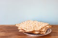 Passover background. matzoh (jewish passover bread) over wooden background. Royalty Free Stock Photo