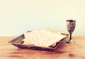 Passover background wine and matzoh jewish passover bread over wooden background