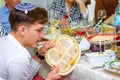 Passover Dinner. Reading the haggadah, jewish family at feast of Passover.