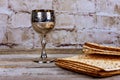 Passover holiday concept with wine and matzoh over rustic background with copy space Royalty Free Stock Photo