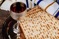 Passover holiday concept with wine and matzoh over rustic background with copy space Royalty Free Stock Photo