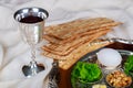 Passover holiday concept with wine and matzoh over rustic background with copy space Royalty Free Stock Photo