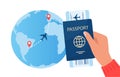 Passport with air ticket in human hand, planet earth with flight route and pins marker. Time to travel concept. Traveling by plane Royalty Free Stock Photo