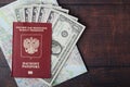 A passport with american dollar banknotes inside as work and travelling concept Royalty Free Stock Photo