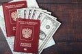 A passport with american dollar banknotes inside as work and travelling concept Royalty Free Stock Photo