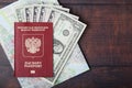 A passport with american dollar banknotes inside as work and travelling concept Royalty Free Stock Photo