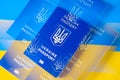 Passport on the background of the Ukrainian Flag