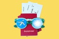 Passport, boarding pass, flight ticket, sunglasses, airplane, shiny sun in blue sky, yellow background, summer holidays, travel Royalty Free Stock Photo