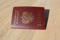 Passport of citizen Russian Federation on a light wooden table, the concept of obtaining a visa, travel, obtaining citizenship, Royalty Free Stock Photo