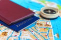 Passport and compass on a map Royalty Free Stock Photo