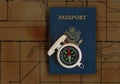 Passport and compass on topographical map