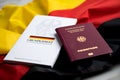 Passport and constitution basic law book of Germany with flag on marble background