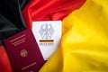Passport and constitution basic law book of Germany on German flag