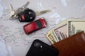 Passport, dollars, car and car keys on slightly blurred USA map Royalty Free Stock Photo