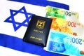 Passport Israel on the Israeli shekel currency ILS and IsraelI flag. Themes: economy, business, citizen