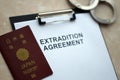 Passport of Japan and Extradition Agreement with handcuffs on table