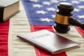 Passport and law gavel on USA flag background, close up view Royalty Free Stock Photo