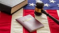 Passport and law gavel on USA flag background, close up view Royalty Free Stock Photo