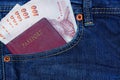 Passport and money in Jean's pocket Royalty Free Stock Photo