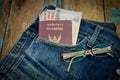 Passport and money on jeans Royalty Free Stock Photo