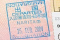 Passport page with the Japan departure immigration control stamp at the Narita airport.