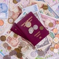 Passport with paper money and coins. Flatlay of vacation on a yellow background Royalty Free Stock Photo